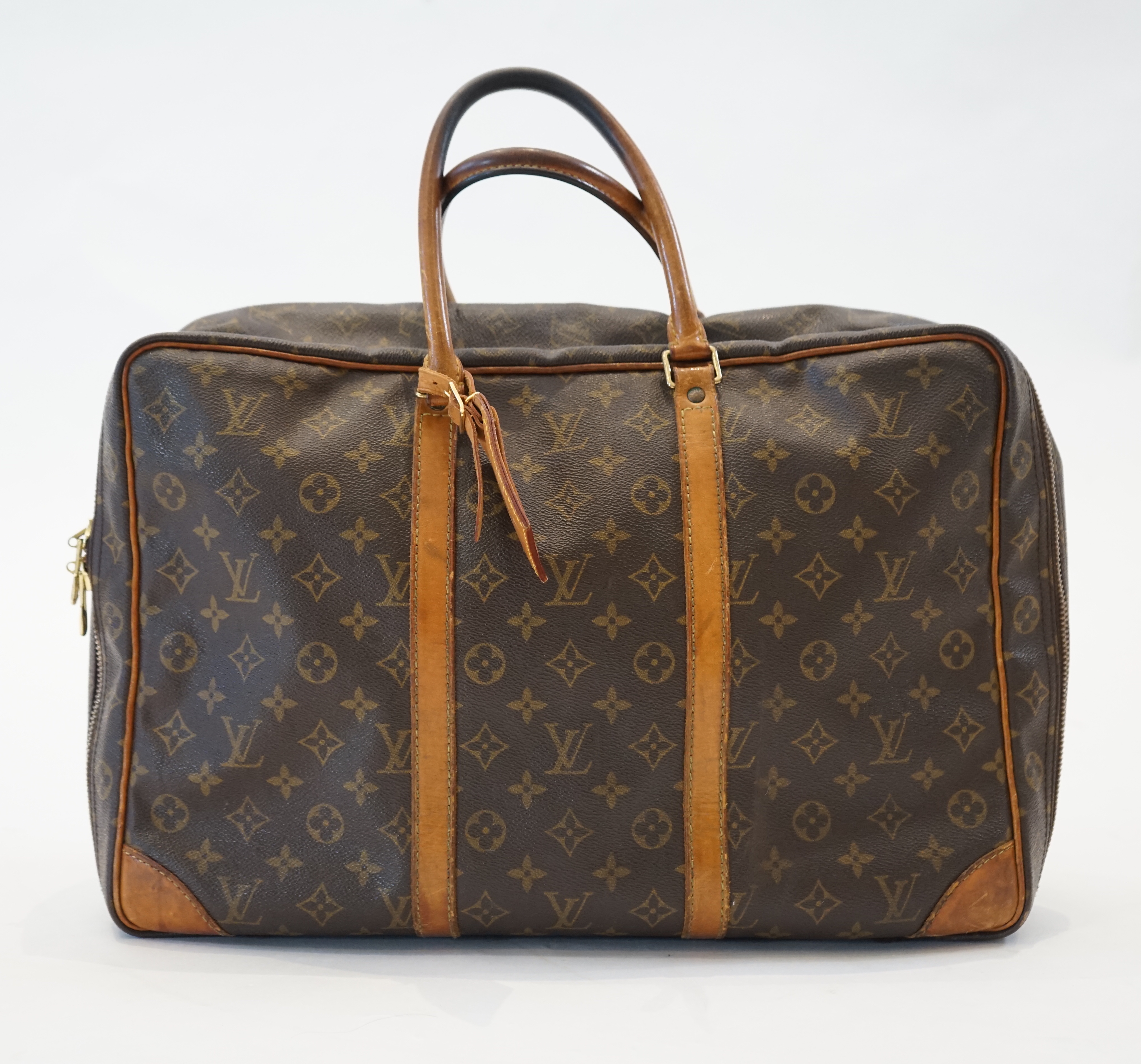 A Louis Vuitton Keepall leather travel bag with luggage tag width 13cm, length 45cm, height 30cm